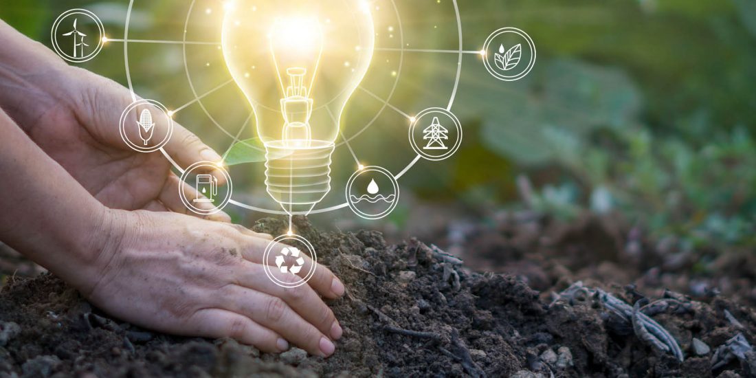 hands in soil, image of lightbulb over