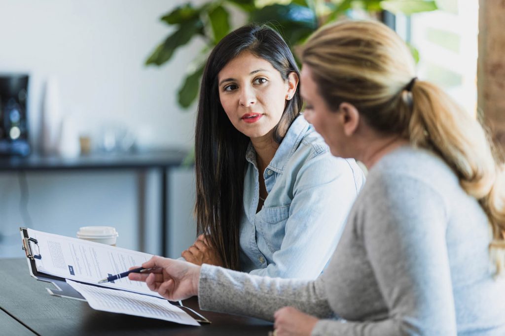 2 women reviewing paperwork